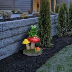 Solar Frog Sitting On Top of Mushroom Statue